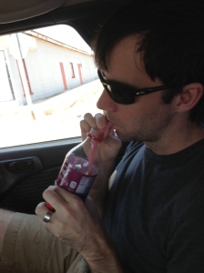 Yes, Lewis is using a sour straw to drink a Cherry Coke. We'd been in the car for many hours.